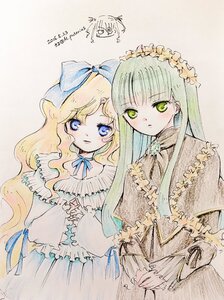 Rating: Safe Score: 0 Tags: 2girls blonde_hair blue_eyes bow dress enju_maiden frills green_eyes hair_bow kiichigo kokuyouseki long_hair long_sleeves multiple_girls pair ribbon traditional_media User: admin