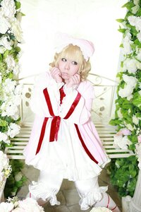 Rating: Safe Score: 0 Tags: 1girl blonde_hair blue_eyes bonnet dress flower frills garden hat hinaichigo long_sleeves rose shoes solo standing striped white_flower white_rose User: admin