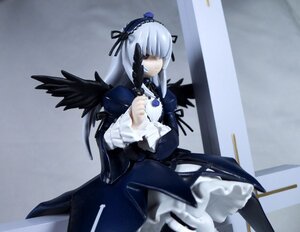 Rating: Safe Score: 0 Tags: 1girl bangs black_ribbon black_wings cross doll dress frills gothic_lolita hairband lolita_fashion long_hair long_sleeves ribbon silver_hair solo suigintou wings User: admin