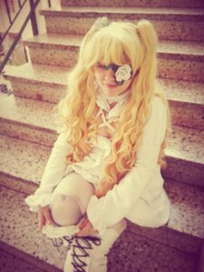 Rating: Safe Score: 0 Tags: 1girl blindfold blonde_hair blurry depth_of_field dress kirakishou long_hair sitting smile solo twintails User: admin