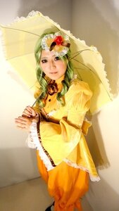 Rating: Safe Score: 0 Tags: 1girl dress drill_hair frills green_hair holding_umbrella kanaria long_sleeves parasol solo standing umbrella wide_sleeves yellow_dress User: admin