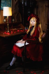 Rating: Safe Score: 0 Tags: 1girl blonde_hair blue_eyes bonnet book dress flower long_hair open_book petals red_dress rose shinku shoes sitting solo User: admin