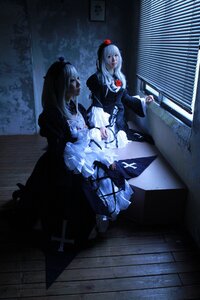 Rating: Safe Score: 0 Tags: cross dark dress hat long_hair multiple_girls silver_hair sitting solo suigintou yagokoro_eirin User: admin