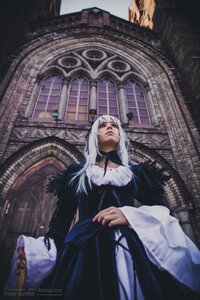 Rating: Safe Score: 0 Tags: 1boy 1girl closed_mouth fur_trim indoors long_hair long_sleeves solo stained_glass standing suigintou white_hair User: admin