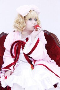 Rating: Safe Score: 0 Tags: 1girl blonde_hair blue_eyes dress food frills fruit hat hinaichigo holding_fruit long_sleeves ribbon solo strawberry striped User: admin