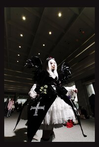 Rating: Safe Score: 0 Tags: 1girl black_border black_dress boots coat cross dress flower hat long_hair petals solo standing suigintou weapon User: admin