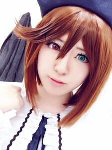 Rating: Safe Score: 0 Tags: 1girl bangs black_headwear brown_hair closed_mouth green_eyes hair_between_eyes hat lips looking_at_viewer portrait red_eyes short_hair simple_background solo souseiseki white_background white_shirt User: admin