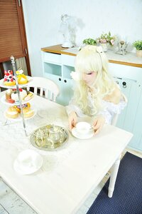 Rating: Safe Score: 0 Tags: 1girl blonde_hair closed_eyes cup dress flower food indoors kirakishou long_hair sitting solo spoon teacup window User: admin