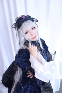 Rating: Safe Score: 0 Tags: 1girl gun hairband handgun holding holding_gun holding_weapon long_hair long_sleeves looking_at_viewer red_eyes silver_hair solo suigintou weapon wings User: admin