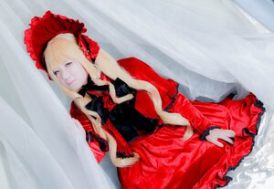 Rating: Safe Score: 0 Tags: 1girl bangs blonde_hair blue_eyes bonnet bow curtains dress flower long_hair long_sleeves red_dress rose shinku sitting solo User: admin