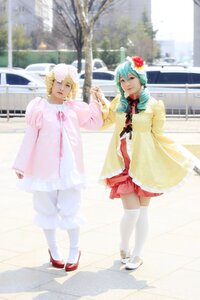Rating: Safe Score: 0 Tags: 2girls aqua_hair blonde_hair blurry day dress flower hair_flower hair_ornament hatsune_miku multiple_cosplay multiple_girls outdoors shoes standing striped tagme thighhighs User: admin
