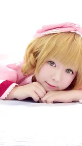 Rating: Safe Score: 0 Tags: 1girl bangs blonde_hair bow chin_rest closed_mouth hinaichigo lips looking_at_viewer short_hair simple_background smile solo User: admin