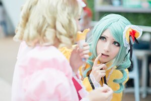 Rating: Safe Score: 0 Tags: 2girls blonde_hair blurry blurry_background blurry_foreground depth_of_field hat komeiji_koishi mini_hat motion_blur multiple_cosplay multiple_girls photo sisters tagme User: admin