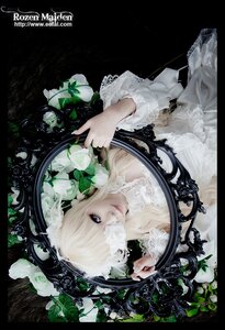 Rating: Safe Score: 0 Tags: 1girl blonde_hair blue_eyes dress flower hair_over_one_eye kirakishou lace lips plant rose solo upper_body white_dress User: admin