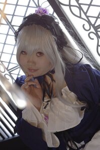 Rating: Safe Score: 0 Tags: 1girl closed_mouth dress flower indoors lips long_sleeves looking_at_viewer red_eyes solo stained_glass suigintou window User: admin