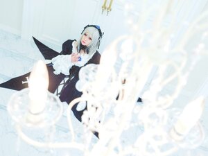Rating: Safe Score: 0 Tags: 1girl blurry blurry_background blurry_foreground depth_of_field dress feathers flower frills hairband long_hair long_sleeves motion_blur nail_polish silver_hair solo suigintou wings User: admin