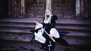 Rating: Safe Score: 0 Tags: 1girl bangs breasts dress hairband holding indoors long_dress long_hair long_sleeves looking_at_viewer outdoors sitting solo suigintou wide_sleeves User: admin