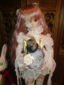 Rating: Safe Score: 0 Tags: 1girl doll dress flower gloves kirakishou lace long_hair pink_hair rose solo white_dress white_flower white_rose User: admin