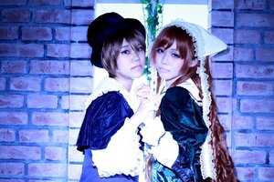 Rating: Safe Score: 0 Tags: 2girls apron brick_wall brown_hair dress hat head_scarf holding_hands interlocked_fingers looking_at_viewer multiple_cosplay multiple_girls tagme User: admin