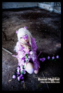 Rating: Safe Score: 0 Tags: 1girl barasuishou black_border copyright_name eyepatch flower hair_flower hair_ornament letterboxed pillarboxed purple_eyes rain rose solo weapon User: admin
