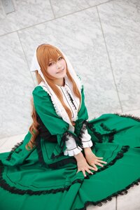 Rating: Safe Score: 0 Tags: 1girl blonde_hair blue_eyes breasts cleavage dress green_dress green_eyes heterochromia long_hair looking_at_viewer red_eyes sitting smile solo suiseiseki v_arms very_long_hair User: admin