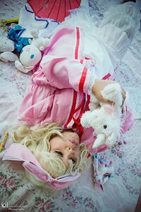 Rating: Safe Score: 0 Tags: 1girl blonde_hair bow bunny dress hair_bow hinaichigo lips lying ribbon solo watermark User: admin