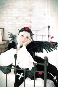 Rating: Safe Score: 0 Tags: 1girl black_dress blurry blurry_background depth_of_field dress flower frills hairband long_sleeves looking_at_viewer solo suigintou User: admin