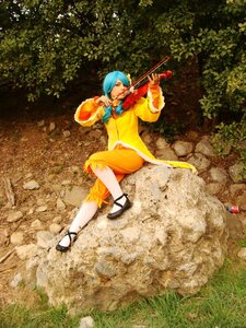Rating: Safe Score: 0 Tags: 1girl blue_hair closed_eyes grass instrument kanaria long_sleeves music playing_instrument sandals sitting solo violin weapon User: admin