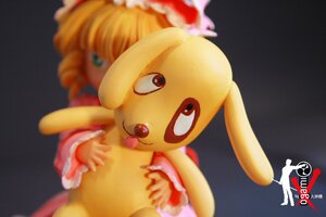 Rating: Safe Score: 0 Tags: 1girl blonde_hair blurry blurry_foreground depth_of_field doll dress food frills fruit hat hina_ichigo hinaichigo long_sleeves photo solo User: admin