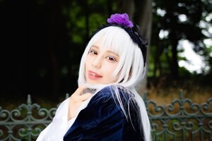 Rating: Safe Score: 0 Tags: 1girl bangs blurry blurry_background depth_of_field flower hairband lips looking_at_viewer red_eyes solo suigintou upper_body User: admin