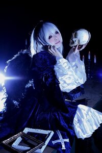 Rating: Safe Score: 0 Tags: 1girl black_eyes dress hood long_sleeves sitting skeleton skull solo suigintou User: admin