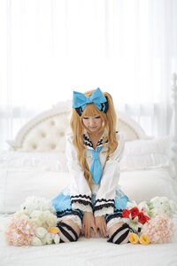 Rating: Safe Score: 0 Tags: 1girl blonde_hair bow closed_eyes dress flower hair_bow long_hair realistic shinku sitting solo striped striped_legwear thighhighs v_arms User: admin
