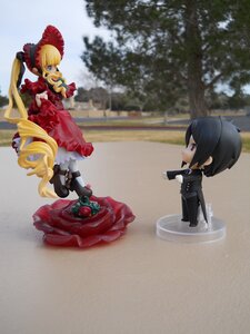 Rating: Safe Score: 0 Tags: 1boy 1girl blonde_hair blue_eyes bonnet boots bow cup doll dress drill_hair flower food long_hair rose shinku sitting solo teacup twintails User: admin