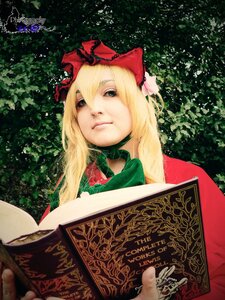 Rating: Safe Score: 0 Tags: 1girl blonde_hair book bow dress hair_bow long_hair open_book shinku solo upper_body User: admin