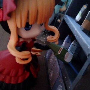 Rating: Safe Score: 0 Tags: 1girl blonde_hair blue_eyes blurry depth_of_field doll dress orange_hair shinku solo upper_body weapon User: admin