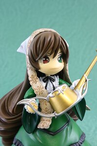 Rating: Safe Score: 0 Tags: 1girl auto_tagged bow brown_hair doll dress frills green_background green_dress head_scarf heterochromia holding long_hair long_sleeves looking_at_viewer red_eyes ribbon solo suiseiseki very_long_hair watering_can User: admin