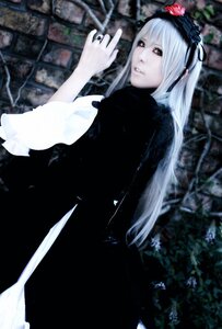 Rating: Safe Score: 0 Tags: 1girl black_dress cross dress flower gothic_lolita hairband jewelry long_hair long_sleeves looking_at_viewer looking_back ring solo suigintou User: admin