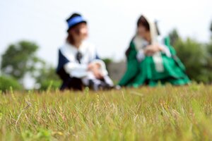 Rating: Safe Score: 0 Tags: 1girl apron blurry blurry_background blurry_foreground depth_of_field dress flower frills grass hat long_sleeves motion_blur multiple_cosplay solo tagme vest white_apron User: admin