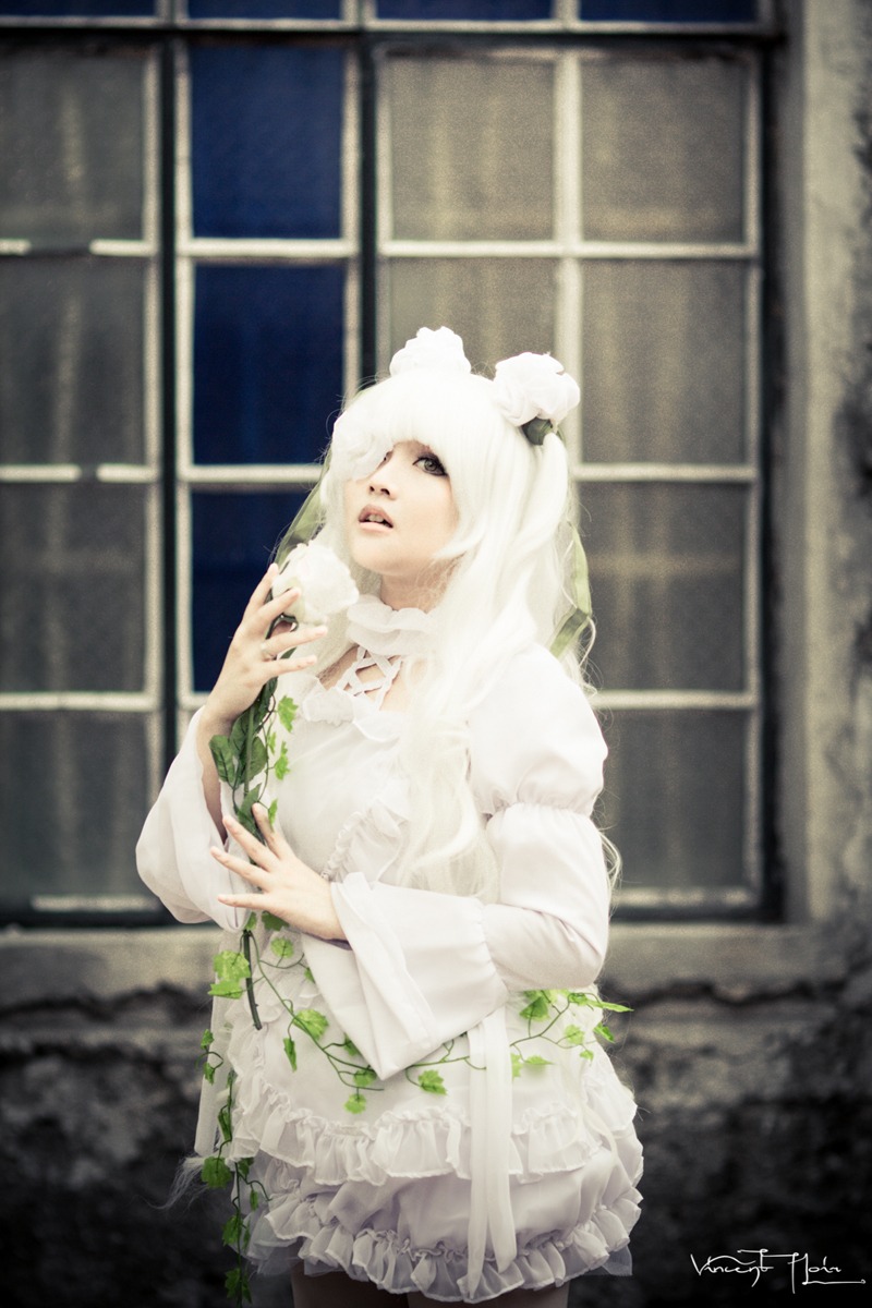 1girl blurry depth_of_field dress kirakishou long_hair long_sleeves signature solo standing white_dress white_hair window