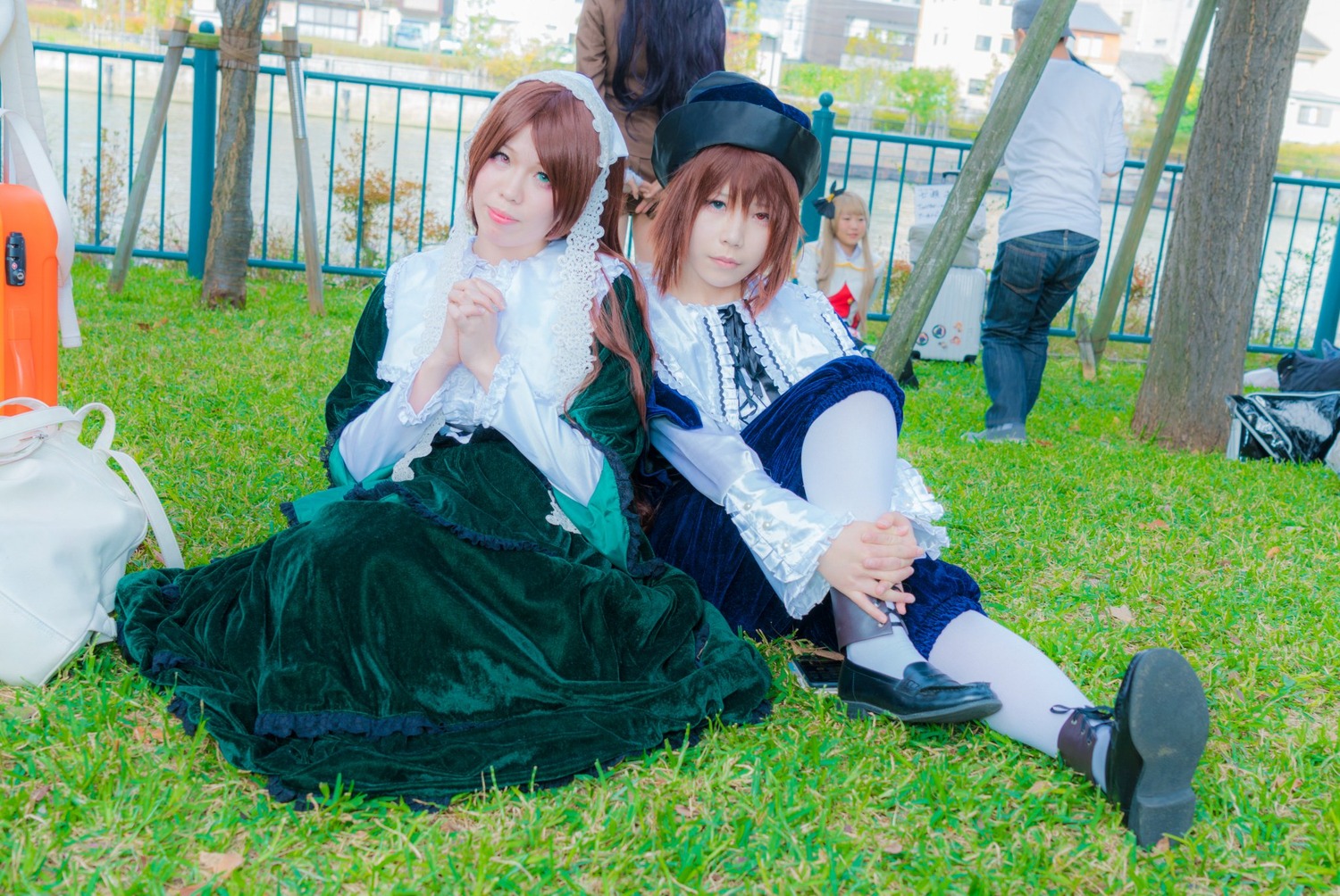 blue_eyes brown_hair building dress grass hat multiple_cosplay multiple_girls outdoors short_hair sitting tagme