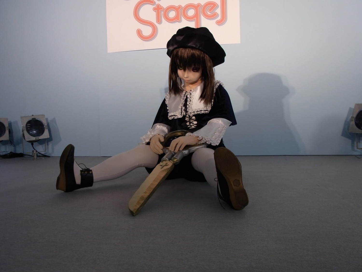 1girl brown_hair dress gun handgun hat holding_gun long_sleeves pantyhose sitting solo souseiseki weapon white_legwear