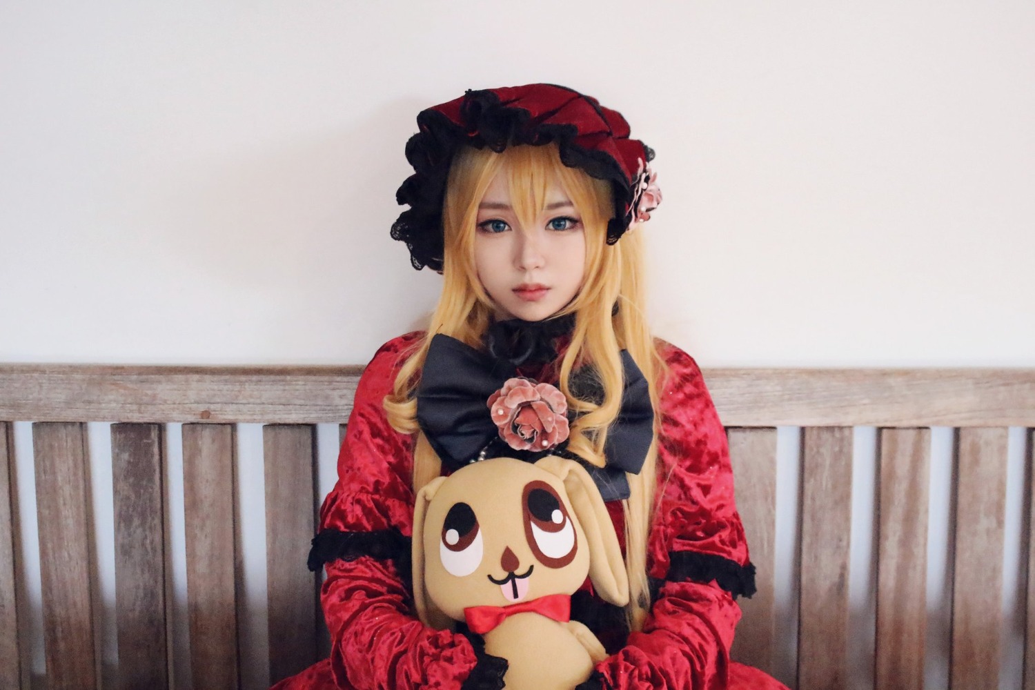 1girl blonde_hair blue_eyes bonnet dress flower lips long_hair long_sleeves looking_at_viewer rose shinku solo stuffed_animal upper_body