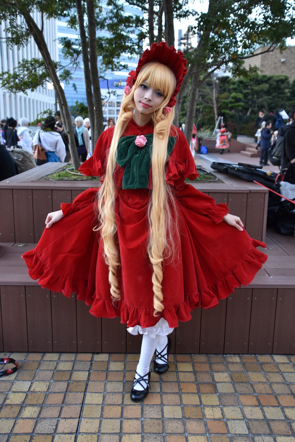 1girl blonde_hair day dress flower long_sleeves looking_at_viewer pavement red_dress shinku shoes solo solo_focus standing white_legwear window