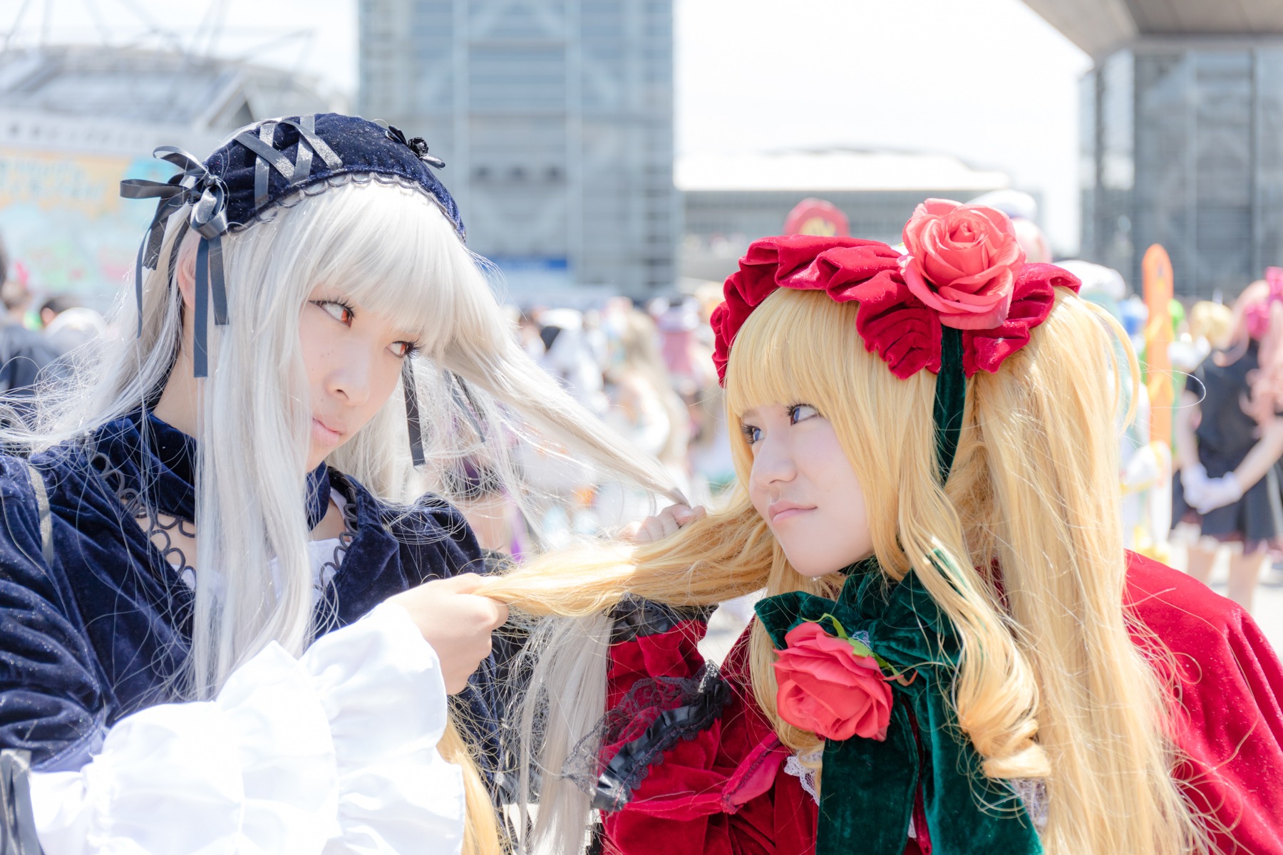 2girls blonde_hair blue_eyes blurry blurry_background bonnet building depth_of_field flower long_hair multiple_cosplay multiple_girls photo red_eyes rose shinku silver_hair suigintou tagme