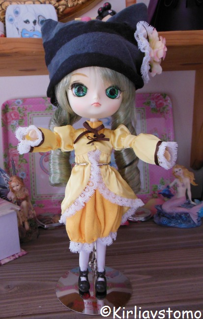 1girl black_footwear blonde_hair doll dress frills green_eyes hat kanaria long_sleeves looking_at_viewer mary_janes shoes solo standing white_legwear yellow_dress