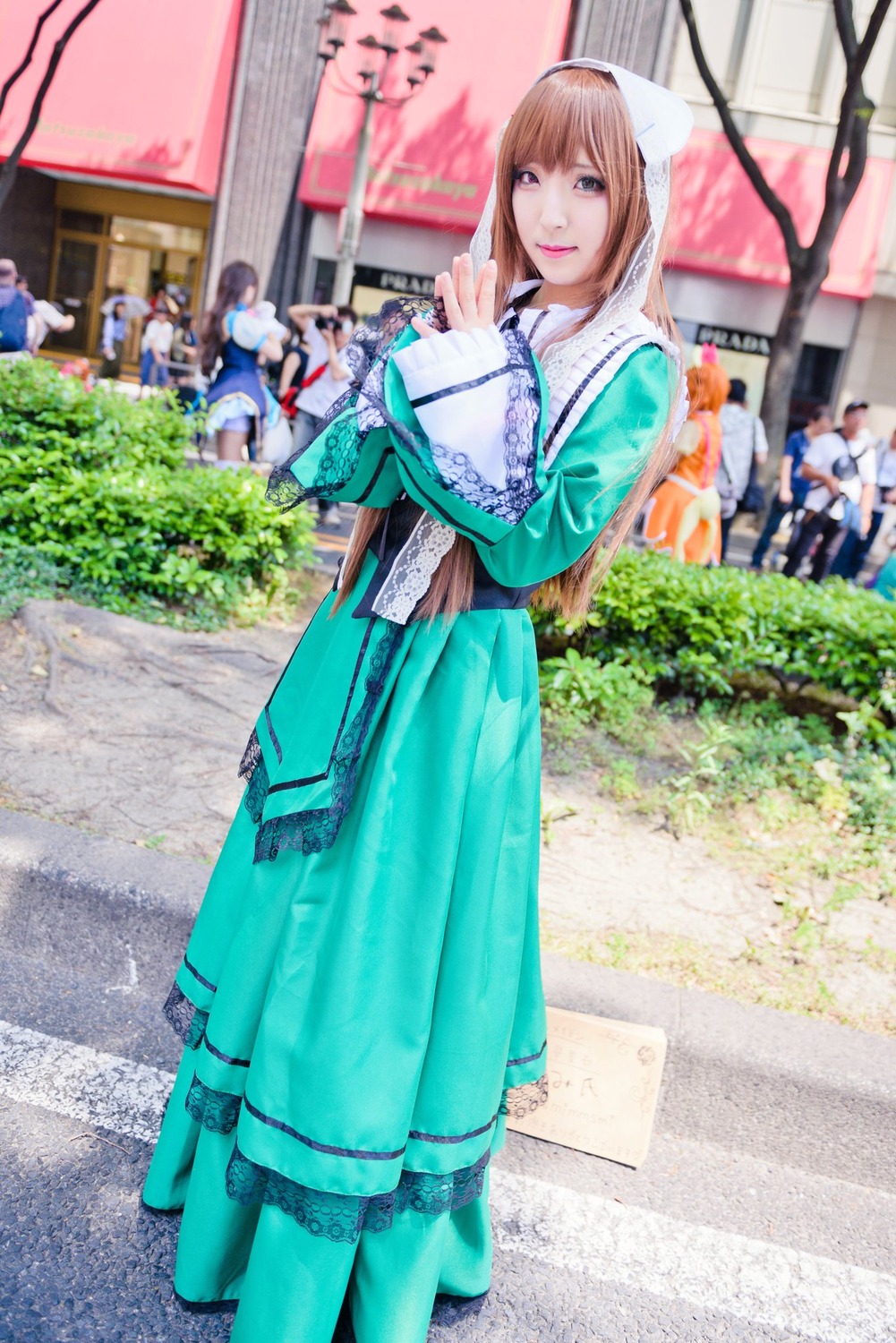blue_dress brown_eyes brown_hair dress long_hair looking_at_viewer outdoors smile solo solo_focus standing suiseiseki