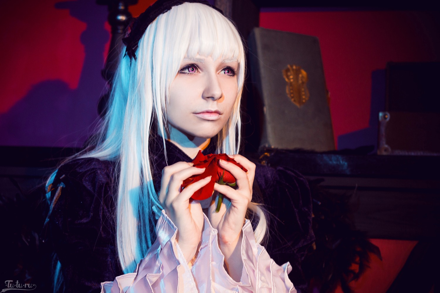 1girl bangs box closed_mouth gift holding lips long_hair looking_at_viewer purple_eyes solo suigintou upper_body white_hair
