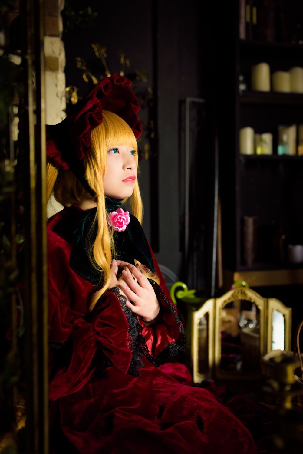 1girl blonde_hair blue_eyes blurry bonnet dress flower lips long_hair long_sleeves realistic red_dress rose shinku sitting solo