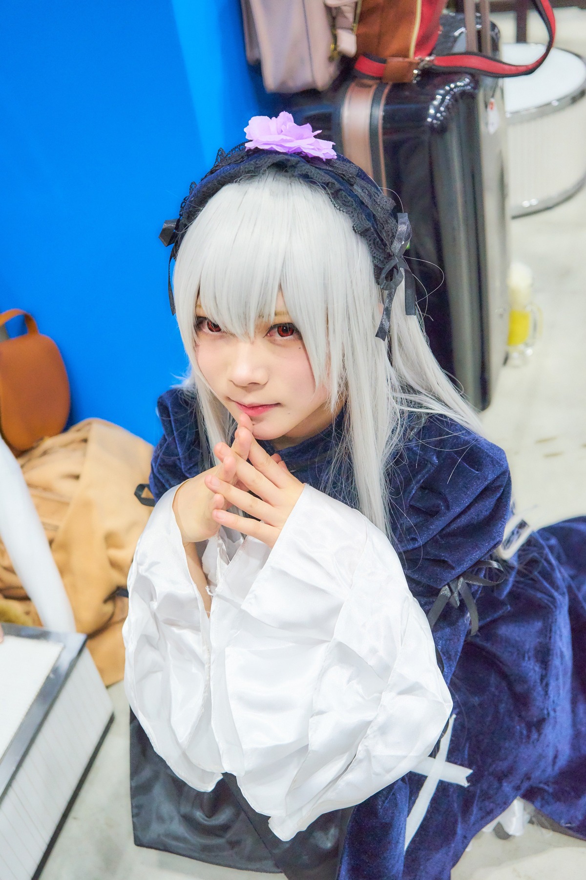 1girl 3d blurry blurry_background blurry_foreground depth_of_field dress figure hairband lips long_hair long_sleeves looking_at_viewer photo red_eyes solo suigintou