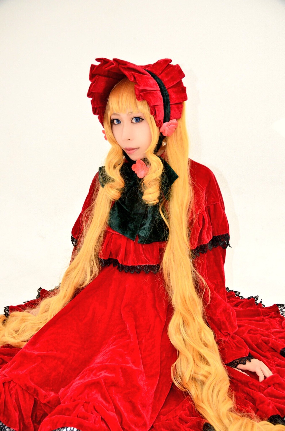 1girl blonde_hair blue_eyes bonnet dress flower frills long_hair long_sleeves red_dress rose shinku sitting solo very_long_hair